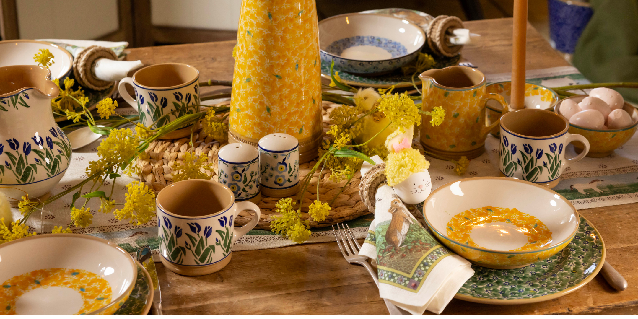 Nicholas Mosse Easter Table set with green lawn, yellow lawn and blue blooms patterns