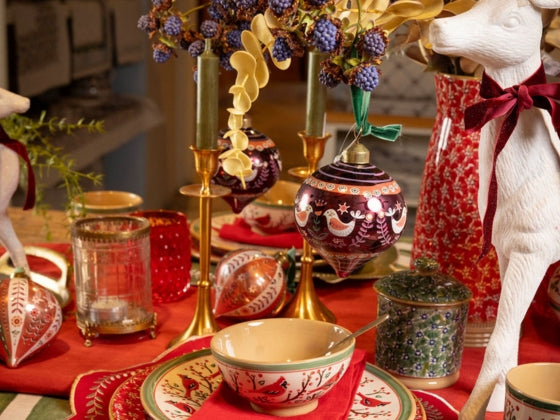 Nicholas Mosse Decorative Christmas table setting with Berry Bird, Green Lawn, and Red Lawn.